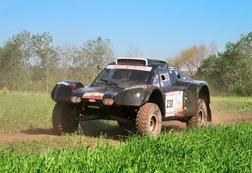 TATARSTAN, RUSSIA - JUNE 15: Marc Chouraqui's Gache Buggy (No. 230) competes at the Rally Transorientale 2008 on June 15, 2008 near city of Naberezhnye Chelny, Tatarstan, Russia.