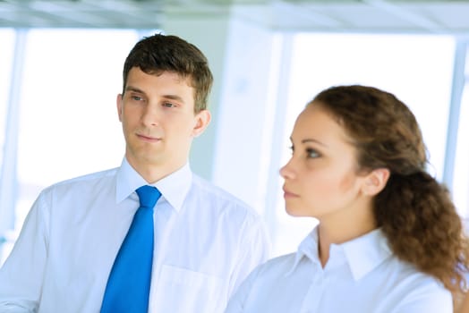 friendly business man and woman discussing a joint task, team work