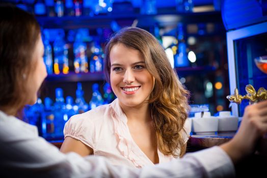 portrait of a young woman in a bar