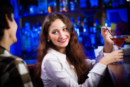 portrait of a young woman in a bar