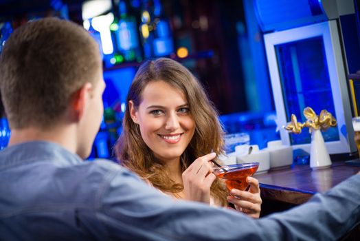 portrait of a young woman in a bar