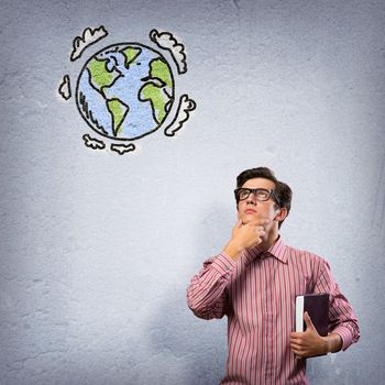 young man with a book thinks. it over symbol planet Earth