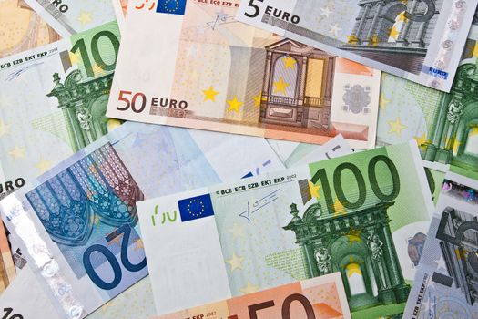 Many euro banknotes making european currency background