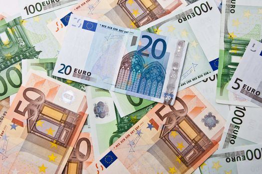 Many euro banknotes making european currency background