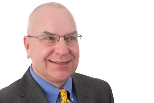 Smiling complacent businessman pleased with his achievements looking to the side with a self-satisfied smile,head and shoulders portrait on white