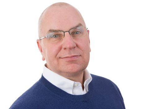 Observant middle-aged businessman looking at the camera with a serious sincere expression and a half smile, head and shoulders portrait on white