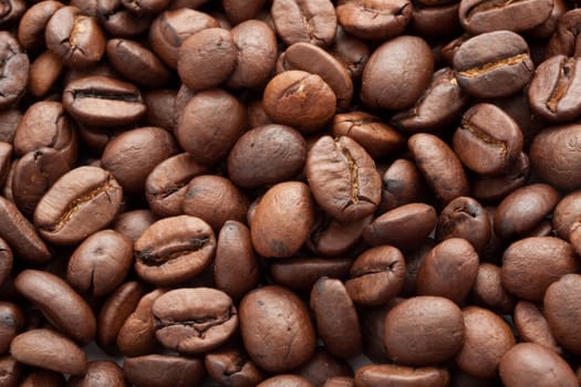 Close-up of brown coffee beans, background texture