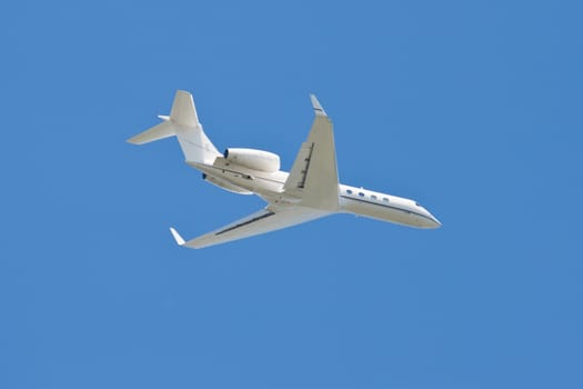 Beautiful white passenger airplane in blue sky