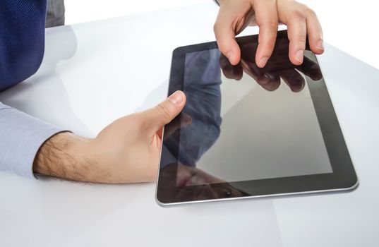 Closeup of man fingers touching screen on modern digital electronic tablet