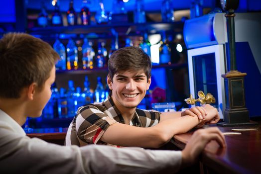 portrait of a young man at the bar, fun nightlife