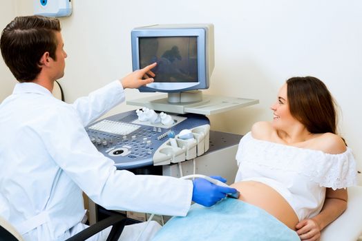 young pregnant woman on the ultrasound, health check