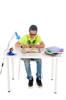 a teenage boy is sitting at his desk, making his homework
