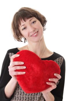 Smiling woman with red plush heart over white