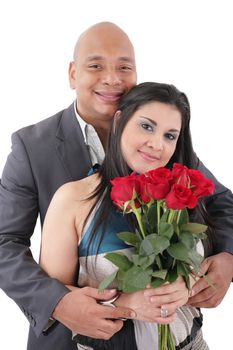 Portrait of happy couple with flowers, looking at camera.