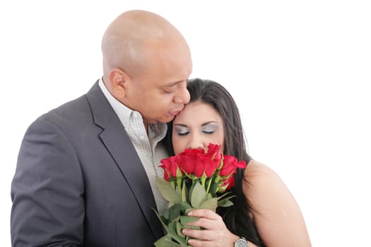 woman enjoys the smell given of a bouquet of roses. Happy couple in love. Valentines day Concept.