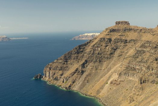 View on rock coastline on Santorini island, Greece.