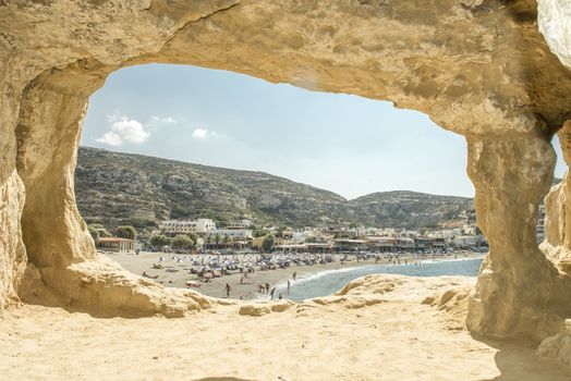 View of Matala's beach from caves, Crete, Greece.