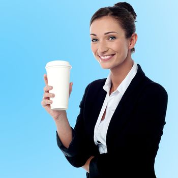 Smiling relaxed businesswoman with beverage