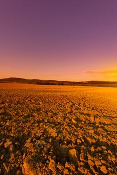 Plowed Sloping Hills of Tuscany at Sunset