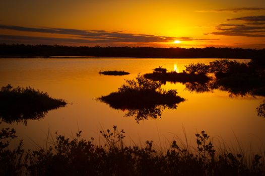 Lake at sunset, Black Point Wildlife Drive, Merritt Island National Wildlife Refuge, Titusville, Florida, USA