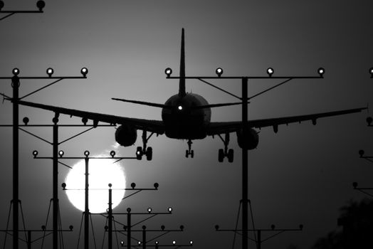 Airplane landing at Los Angeles International Airport during sunset, Los Angeles, California, USA