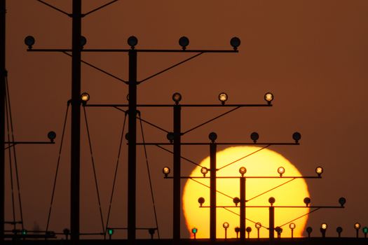 Landing lights during sunset at Los Angeles International Airport, Los Angeles, California, USA