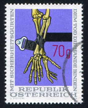 AUSTRIA - CIRCA 1975: stamp printed by Austria, shows Safety Belt and Skeleton Arms, circa 1975
