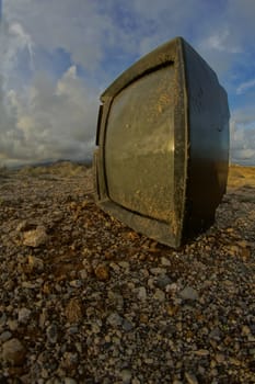 Hdr icture of Abandoned Broken Television in the Desert on a Cloudy Day