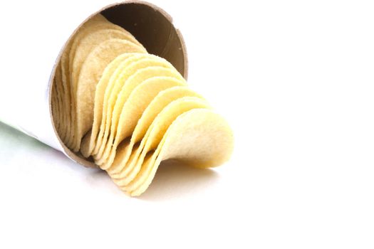 Tasty potato crisps (chips) isolated on a white background