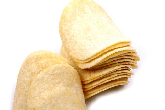 Tasty potato crisps (chips) isolated on a white background