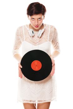 cute redhead woman looking diabolic holding a vinyl record
