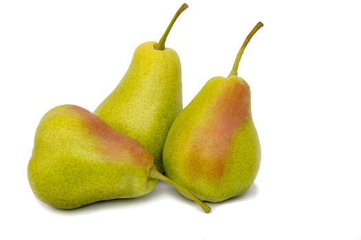 Three large ripe yellow pears. Presented on a white background.