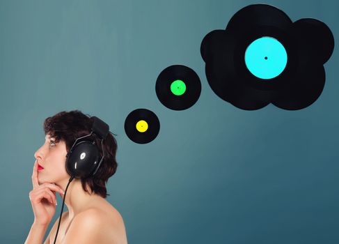 young woman thinking about music with vinyl record thinking balloons