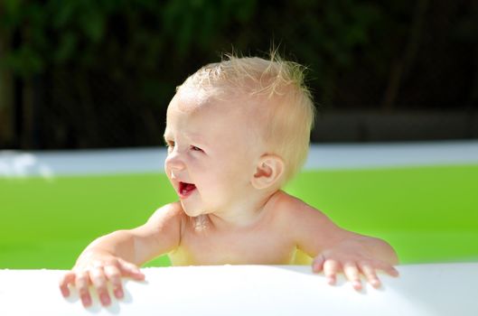 Happy Baby Boy Portrait in the Pool at Sunny Summer Day