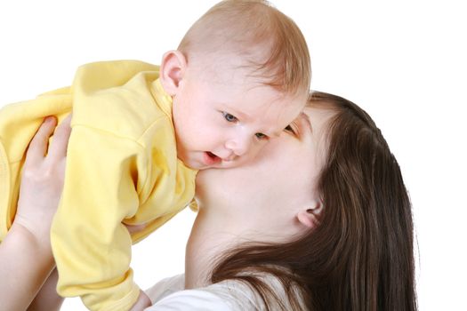 Young Mother kissing the beautiful Baby Boy Isolated on the White Background