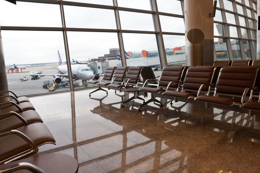 Beautiful photo of airport terminal hall with big windows