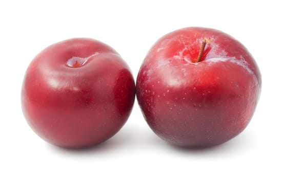 Fresh tasty plums isolated on white background