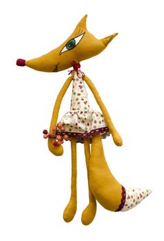 The Handmade soft toy fox isolated in dress and berries