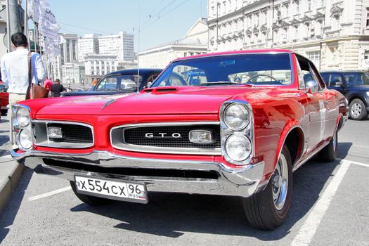 MOSCOW, RUSSIA - JUNE 2: American muscle car Pontiac GTO competes at the annual L.U.C. Chopard Classic Weekend Rally on June 2, 2013 in Moscow, Russia.