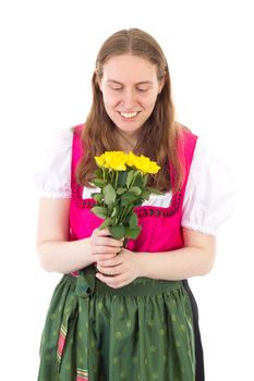 Beautiful woman in dirndl happy about these roses