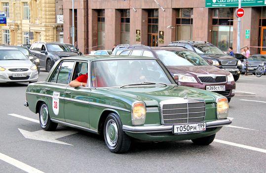 MOSCOW, RUSSIA - JUNE 2: German motor car Mercedes-Benz W114 E-class competes at the annual L.U.C. Chopard Classic Weekend Rally on June 2, 2013 in Moscow, Russia.