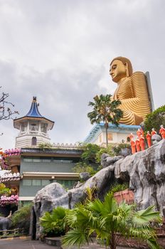 Buddhist monk statues at Dambulla Golden Temple in Sri Lanka