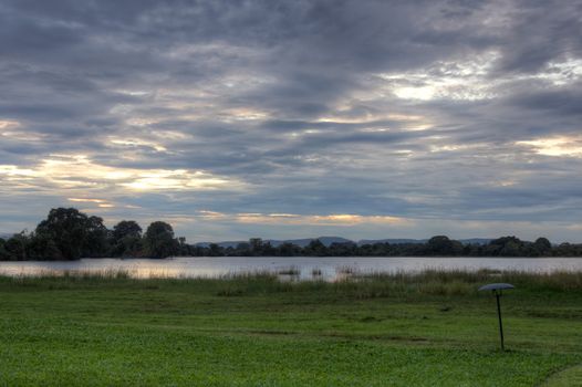 Sunset at a lake in a cloudy day in Sri Lanka