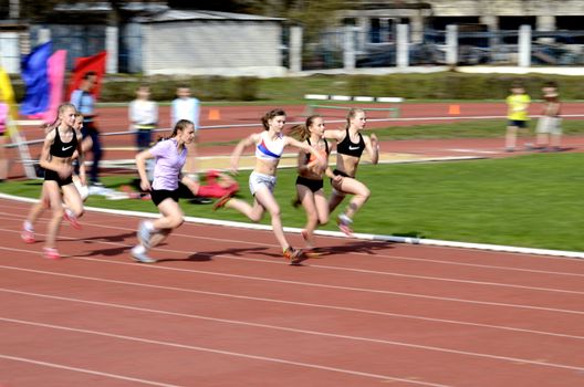  The race of young sportswomen during competitions at open stadium