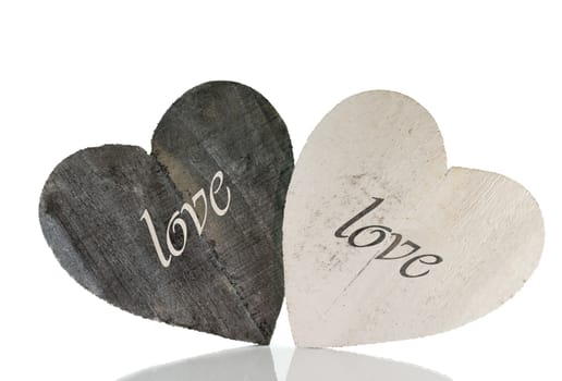 two wooden heart shapes for valentines with space for text isolated on white background