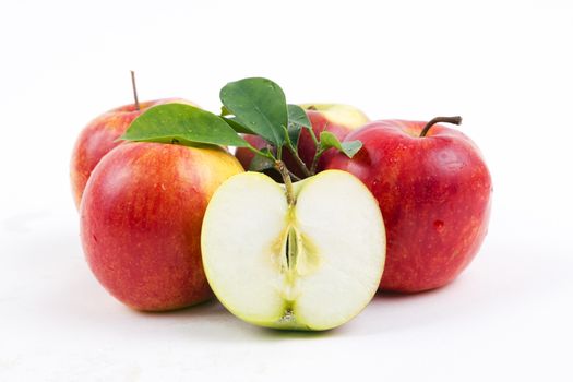 Fresh apples with half on a white background