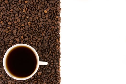 Coffee cup with coffee beans on a white background.