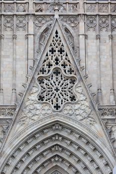 Facade details of famous Gothic Catholic Cathedral, Barcelona, Spain