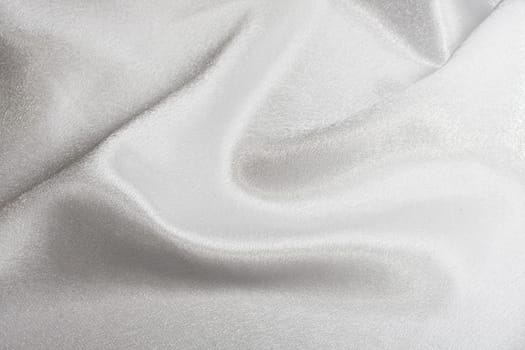 Abstract background white silk fabric with beautiful waves