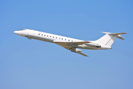 Beautiful white passenger airplane in blue sky